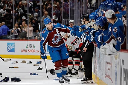 Dec 21, 2023; Denver, Colorado, USA; Colorado Avalanche center Nathan MacKinnon (29) celebrates his hat trick goal with the bench in the third period against the Ottawa Senators at Ball Arena. Mandatory Credit: Isaiah J. Downing-USA TODAY Sports