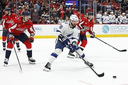 Dec 23, 2023; Washington, District of Columbia, USA; Tampa Bay Lightning right wing Nikita Kucherov (86) skates with the puck as Washington Capitals defenseman Martin Fehervary (42) defends in the second period at Capital One Arena. Mandatory Credit: Geoff Burke-USA TODAY Sports