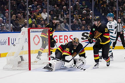 Dec 23, 2023; Vancouver, British Columbia, CAN; San Jose Sharks forward William Eklund (72) and Vancouver Canucks forward Nils Hoglander (21) watch the shot from forward Fabian Zetterlund (20) beat goalie Thatcher Demko (35) in the second period at Rogers Arena. Mandatory Credit: Bob Frid-USA TODAY Sports