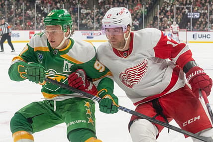Dec 27, 2023; Saint Paul, Minnesota, USA; Detroit Red Wings right wing Daniel Sprong (17) checks Minnesota Wild left wing Kirill Kaprizov (97) in the first period at Xcel Energy Center. Mandatory Credit: Matt Blewett-USA TODAY Sports