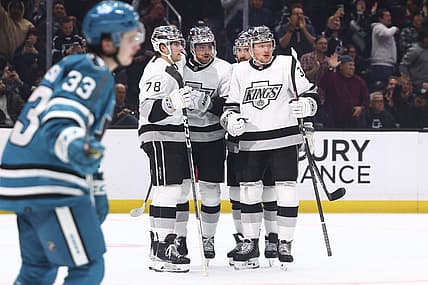 Dec 27, 2023; Los Angeles, California, USA; Los Angeles Kings center Pierre-Luc Dubois (80) celebrates with his teammates after scoring a gaol during the second period of a game against the San Jose Sharks at Crypto.com Arena. Mandatory Credit: Jessica Alcheh-USA TODAY Sports