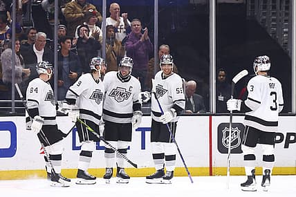 Dec 27, 2023; Los Angeles, California, USA; Los Angeles Kings right wing Adrian Kempe (9) celebrates with his teammates after scoring a goal during the third period of a game against the San Jose Sharks at Crypto.com Arena. Mandatory Credit: Jessica Alcheh-USA TODAY Sports