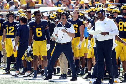Outgoing head coach Jim Harbaugh endorsed offensive coordinator Sherrone Moore, right, as the next coach of the Wolverines.