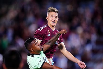 Sep 30, 2023; Commerce City, Colorado, USA; Austin FC midfielder Jhojan Valencia (5) and Colorado Rapids midfielder Cole Bassett (23) during the second half at Dick's Sporting Goods Park. Mandatory Credit: Ron Chenoy-USA TODAY Sports