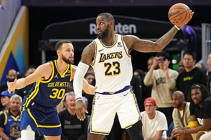 Jan 27, 2024; San Francisco, California, USA; Golden State Warriors forward Draymond Green (23) handles the ball against Golden State Warriors guard Stephen Curry (30) during overtime at Chase Center. Mandatory Credit: Darren Yamashita-USA TODAY Sports