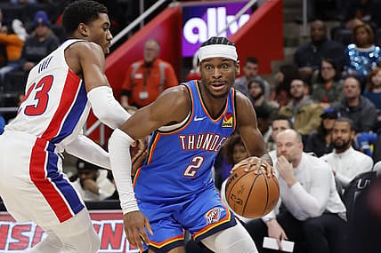 Jan 28, 2024; Detroit, Michigan, USA; Oklahoma City Thunder guard Shai Gilgeous-Alexander (2) dribbles defended by Detroit Pistons guard Jaden Ivey (23) in the first half at Little Caesars Arena. Mandatory Credit: Rick Osentoski-USA TODAY Sports