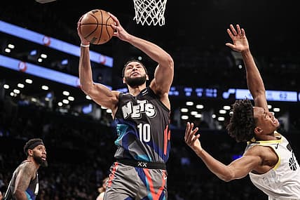 Jan 29, 2024; Brooklyn, New York, USA;  Brooklyn Nets guard Ben Simmons (10) grabs a rebound past Utah Jazz guard Collin Sexton (2) in the second quarter against the Utah Jazz at Barclays Center. Mandatory Credit: Wendell Cruz-USA TODAY Sports