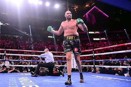 Oct 9, 2021; Las Vegas, Nevada, USA; Deontay Wilder (red/black trunks) is knocked out by Tyson Fury (black/gold trunks) during their WBC/Lineal heavyweight championship boxing match at T-Mobile Arena. Mandatory Credit: Joe Camporeale-USA TODAY Sports