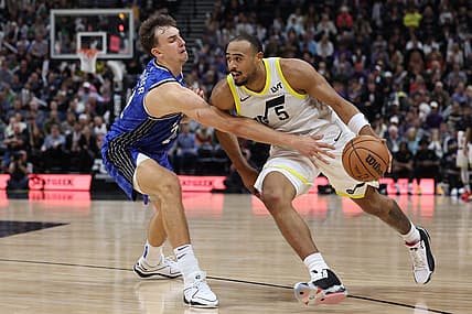 Nov 2, 2023; Salt Lake City, Utah, USA; Utah Jazz guard Talen Horton-Tucker (5) drives against Orlando Magic forward Franz Wagner (22) in the fourth quarter at the Delta Center. Mandatory Credit: Rob Gray-USA TODAY Sports