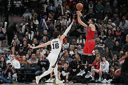 Jan 13, 2024; San Antonio, Texas, USA;  Chicago Bulls guard Zach LaVine (8) shoots over San Antonio Spurs forward Cedi Osman (16) in the second half at Frost Bank Center. Mandatory Credit: Daniel Dunn-USA TODAY Sports