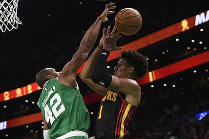 Feb 7, 2024; Boston, Massachusetts, USA;  Boston Celtics center Al Horford (42) blocks the shot of Atlanta Hawks forward Jalen Johnson (1) during the first half at TD Garden. Mandatory Credit: Bob DeChiara-USA TODAY Sports