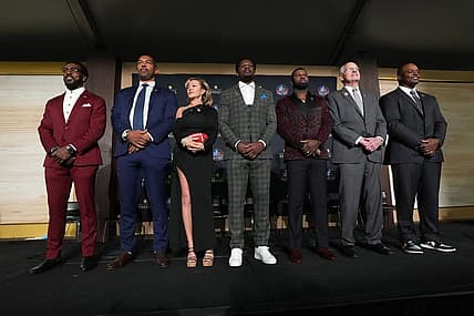Feb 8, 2024; Las Vegas, NV, USA; Pro Football Hall of Fame Class of 2024 inductees pose at press conference at the Resorts World Theatre. From left: Patrick Willis, Julius Peppers, Misty McMichael (representing Steve McMichael), Andre Johnson, Devin Hester, Randy Grdishar and Dwight Freeney. Mandatory Credit: Kirby Lee-USA TODAY Sports