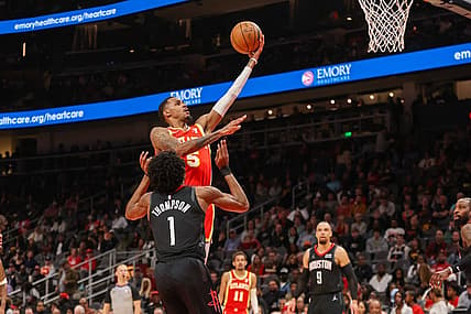 Feb 10, 2024; Atlanta, Georgia, USA; Atlanta Hawks guard Dejounte Murray (5) shoots against the Houston Rockets in the second quarter at State Farm Arena. Mandatory Credit: Brett Davis-USA TODAY Sports