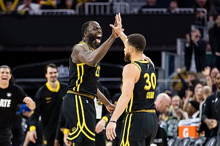 Feb 10, 2024; San Francisco, California, USA; Golden State Warriors center Draymond Green (23) and guard Stephen Curry (30) celebrate after scoring against the Phoenix Suns during the second half at Chase Center. Mandatory Credit: John Hefti-USA TODAY Sports