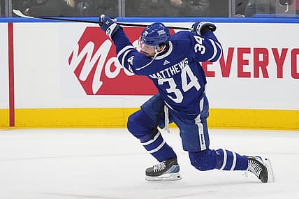 Feb 13, 2024; Toronto, Ontario, CAN; Toronto Maple Leafs forward Auston Matthews (34) shoots the puck during warm up before a game against the St. Louis Blues at Scotiabank Arena. Mandatory Credit: John E. Sokolowski-USA TODAY Sports