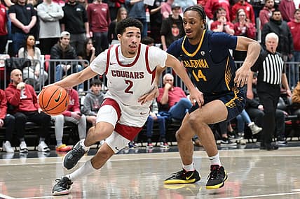 Feb 15, 2024; Pullman, Washington, USA; Washington State Cougars guard Myles Rice (2) runs the baseline against California Golden Bears forward Grant Newell (14) in the second half at Friel Court at Beasley Coliseum. Washington State Cougars won 84-65. Mandatory Credit: James Snook-USA TODAY Sports