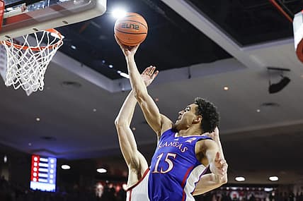 Feb 17, 2024; Norman, Oklahoma, USA; Kansas Jayhawks guard Kevin McCullar Jr. (15) goes to the basket against the Oklahoma Sooners during the first half at Lloyd Noble Center. Mandatory Credit: Alonzo Adams-USA TODAY Sports