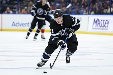 Feb 17, 2024; Tampa, Florida, USA;  Tampa Bay Lightning center Brayden Point (21) controls the puck against the Florida Panthers in the third period at Amalie Arena. Mandatory Credit: Nathan Ray Seebeck-USA TODAY Sports
