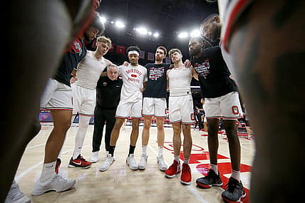 Feb 18, 2024; Columbus, Ohio, USA;  Ohio State Buckeyes guard Bowen Hardman (left) and guard Roddy Gayle Jr. (center) and forward Jamison Battle (center right) and guard Colby Baumann (42) huddle up before the game against the Purdue Boilermakers at Value City Arena. Mandatory Credit: Joseph Maiorana-USA TODAY Sports