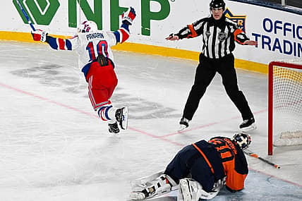 Feb 18, 2024; East Rutherford, New Jersey, USA;  New York Rangers left wing Artemi Panarin (10) celebrates his game winning goal against the New York Islanders during the overtime period in a Stadium Series ice hockey game at MetLife Stadium. Mandatory Credit: Dennis Schneidler-USA TODAY Sports