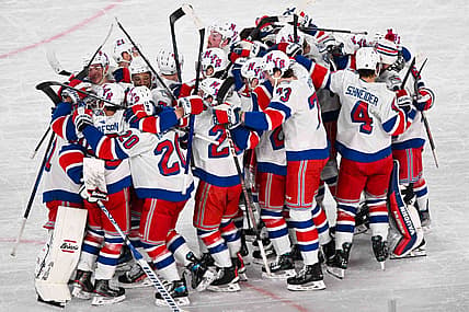 Feb 18, 2024; East Rutherford, New Jersey, USA;  The New York Rangers  celebrate the 6-5 victory over the the New York Islanders  after the game in a Stadium Series ice hockey game at MetLife Stadium. Mandatory Credit: Dennis Schneidler-USA TODAY Sports