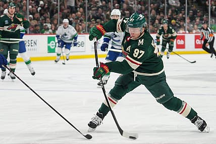 Feb 19, 2024; Saint Paul, Minnesota, USA; Minnesota Wild left wing Kirill Kaprizov (97) shoots against the Vancouver Canucks in the second period at Xcel Energy Center. Mandatory Credit: Matt Blewett-USA TODAY Sports