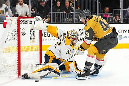 Feb 20, 2024; Las Vegas, Nevada, USA; Vegas Golden Knights center Paul Cotter (43) shoots against Nashville Predators goaltender Kevin Lankinen (32) during the second period at T-Mobile Arena. Mandatory Credit: Stephen R. Sylvanie-USA TODAY Sports