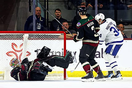 Feb 21, 2024; Tempe, Arizona, USA; Toronto Maple Leafs center Auston Matthews (34) scores a goal against Arizona Coyotes goaltender Karel Vejmelka (70) during the second period at Mullett Arena. Mandatory Credit: Mark J. Rebilas-USA TODAY Sports