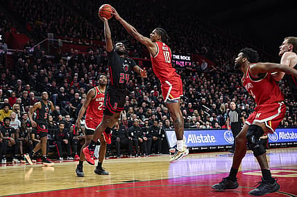 Feb 25, 2024; Piscataway, New Jersey, USA; Maryland Terrapins forward Julian Reese (10) blocks a shot by Rutgers Scarlet Knights guard Austin Williams (24) during the second half at Jersey Mike's Arena. Mandatory Credit: Vincent Carchietta-USA TODAY Sports