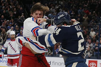 Feb 25, 2024; Columbus, Ohio, USA; Columbus Blue Jackets right wing Mathieu Olivier (24) and New York Rangers center Matt Rempe (73) fight during the first period at Nationwide Arena. Mandatory Credit: Russell LaBounty-USA TODAY Sports
