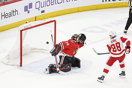 Feb 25, 2024; Chicago, Illinois, USA; Detroit Red Wings right wing Patrick Kane (88) scores game winning goal against Chicago Blackhawks goaltender Petr Mrazek (34) in overtime at United Center. Mandatory Credit: Kamil Krzaczynski-USA TODAY Sports