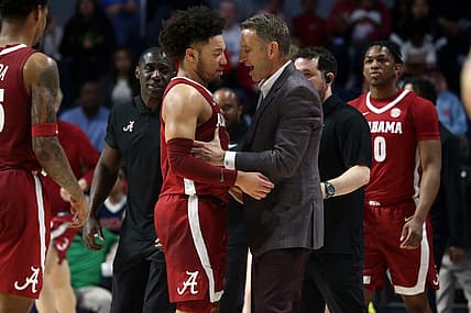 Feb 28, 2024; Oxford, Mississippi, USA; Alabama Crimson Tide head coach Nate Oats (right) embraces Alabama Crimson Tide guard Mark Sears (1) at the end of the first half against the Mississippi Rebels at The Sandy and John Black Pavilion at Ole Miss. Mandatory Credit: Petre Thomas-USA TODAY Sports
