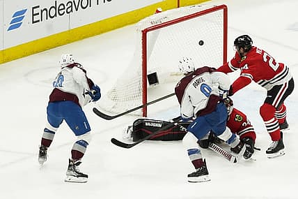 Feb 29, 2024; Chicago, Illinois, USA; Colorado Avalanche center Ross Colton (20) scores a goal on Chicago Blackhawks goaltender Petr Mrazek (34) during the second period at United Center. Mandatory Credit: David Banks-USA TODAY Sports