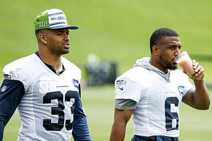 Jun 7, 2022; Renton, Washington, USA; Seattle Seahawks strong safety Jamal Adams (33) and free safety Quandre Diggs (6) walk on the field during minicamp practice at the Virginia Mason Athletic Center Field. Mandatory Credit: Joe Nicholson-USA TODAY Sports