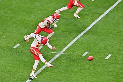 Feb 12, 2023; Glendale, Arizona, US; Kansas City Chiefs place kicker Harrison Butker (7) kicks off against the Philadelphia Eagles to start Super Bowl LVII at State Farm Stadium. Mandatory Credit: Matt Kartozian-USA TODAY Sports