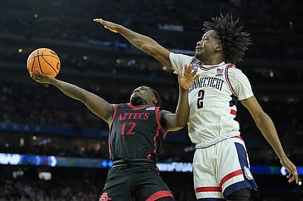 Apr 3, 2023; Houston, TX, USA; San Diego State Aztecs guard Darrion Trammell (12) shoots the ball against Connecticut Huskies guard Tristen Newton (2) during the second half in the national championship game of the 2023 NCAA Tournament at NRG Stadium. Mandatory Credit: Bob Donnan-USA TODAY Sports
