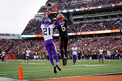 Cincinnati Bengals wide receiver Tee Higgins (5) catches a touchdown pass as Minnesota Vikings cornerback Akayleb Evans (21) defends in the fourth quarter of a Week 15 NFL football game between the Minnesota Vikings and the Cincinnati Bengals, Saturday, Dec. 16, 2023, at Paycor Stadium in Cincinnati. The Cincinnati Bengals won 27-24 in overtime.