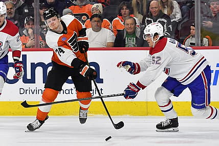Jan 10, 2024; Philadelphia, Pennsylvania, USA; Philadelphia Flyers right wing Owen Tippett (74) takes a shot on goal against Montreal Canadiens defenseman Justin Barron (52) during third period at Wells Fargo Center. Mandatory Credit: Eric Hartline-USA TODAY Sports