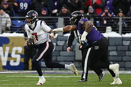 Jan 20, 2024; Baltimore, MD, USA; Houston Texans quarterback C.J. Stroud (7) runs the ball against Baltimore Ravens defensive tackle Justin Madubuike (92) during the first quarter of a 2024 AFC divisional round game at M&T Bank Stadium. Mandatory Credit: Tommy Gilligan-USA TODAY Sports