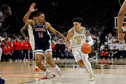 Feb 10, 2024; Boulder, Colorado, USA; Colorado Buffaloes guard KJ Simpson (2) controls the ball against Arizona Wildcats forward Keshad Johnson (16) in the second half at CU Events Center. Mandatory Credit: Isaiah J. Downing-USA TODAY Sports