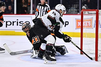 Feb 12, 2024; Philadelphia, Pennsylvania, USA; Arizona Coyotes center Alex Kerfoot (15) scores a goal against Philadelphia Flyers goalie Samuel Ersson (33) in the second period at Wells Fargo Center. Mandatory Credit: Kyle Ross-USA TODAY Sports