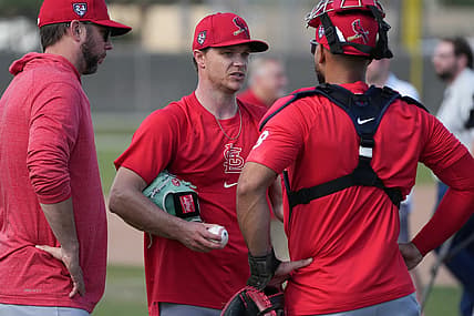 Feb 15, 2024; Jupiter, FL, USA;  St. Louis Cardinals starting pitcher Sonny Gray, center, talks with catcher Ivan Herrera (48) during workouts at spring training. Mandatory Credit: Jim Rassol-USA TODAY Sports