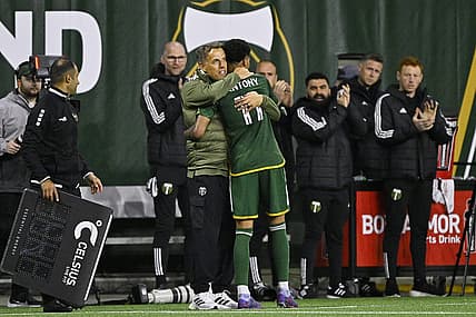 Feb 24, 2024; Portland, Oregon, USA; Portland Timbers head coach Phil Neville hugs forward Antony (11) during the second half against the Colorado Rapids at Providence Park. Mandatory Credit: Troy Wayrynen-USA TODAY Sports