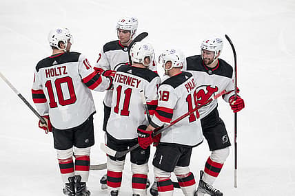 Feb 27, 2024; San Jose, California, USA;  New Jersey Devils right wing Alexander Holtz (10) and center Chris Tierney (11) and left wing Ondrej Palat (18) and defenseman Brendan Smith (2) and defenseman Simon Nemec (17) celebrate after the goal against the San Jose Sharks during the third period at SAP Center at San Jose. Mandatory Credit: Neville E. Guard-USA TODAY Sports