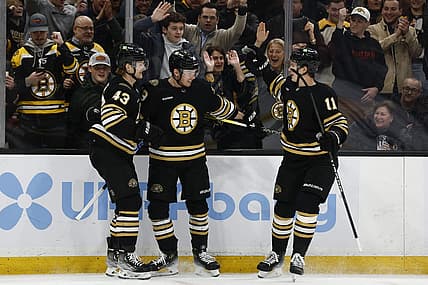 Feb 29, 2024; Boston, Massachusetts, USA; Boston Bruins center Morgan Geekie (39) (center) celebrates his goal with left wing Danton Heinen (43) and center Trent Frederic (11) during the first period against the Vegas Golden Knights at TD Garden. Mandatory Credit: Winslow Townson-USA TODAY Sports