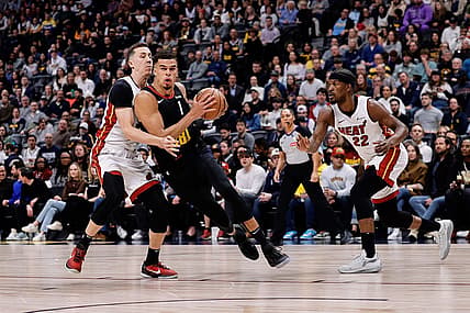 Feb 29, 2024; Denver, Colorado, USA; Denver Nuggets forward Michael Porter Jr. (1) drives to the basket against Miami Heat forward Duncan Robinson (55) in the first quarter at Ball Arena. Mandatory Credit: Isaiah J. Downing-USA TODAY Sports