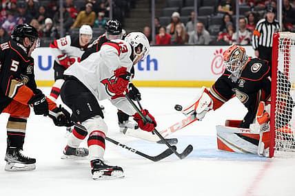 Mar 1, 2024; Anaheim, California, USA; New Jersey Devils center Nico Hischier (13) shoots the puck against Anaheim Ducks goaltender Lukas Dostal (1) during the first period at Honda Center. Mandatory Credit: Kiyoshi Mio-USA TODAY Sports