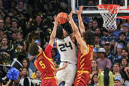 Mar 2, 2024; Orlando, Florida, USA; UCF Knights guard Jaylin Sellers (24) goes to the basket against Iowa State Cyclones guard Curtis Jones (5) and forward Robert Jones (12) during the first half at Addition Financial Arena. Mandatory Credit: Mike Watters-USA TODAY Sports