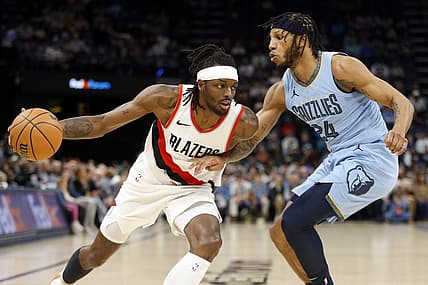 Mar 2, 2024; Memphis, Tennessee, USA; Portland Trail Blazers forward Jerami Grant (9) drives to the basket as Memphis Grizzlies forward Lamar Stevens (24) defends during the first half at FedExForum. Mandatory Credit: Petre Thomas-USA TODAY Sports