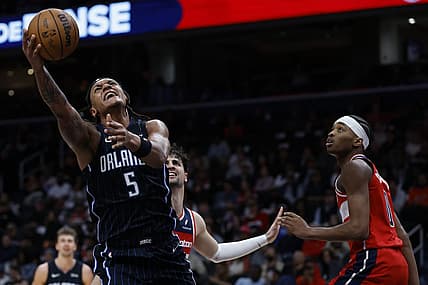 Mar 6, 2024; Washington, District of Columbia, USA; Orlando Magic forward Paolo Banchero (5) shoots the ball as Washington Wizards guard Bilal Coulibaly (0) looks on in the first half at Capital One Arena. Mandatory Credit: Geoff Burke-USA TODAY Sports